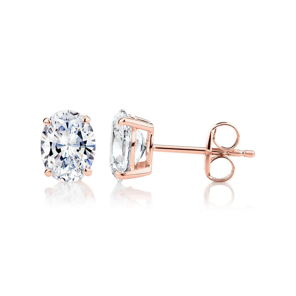 Oval stud earrings with 2 carats* of diamond simulants in 10 carat rose gold